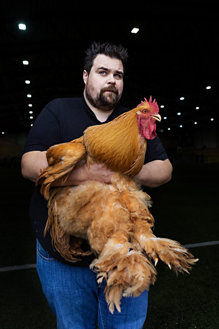 Man with his cochin rooster